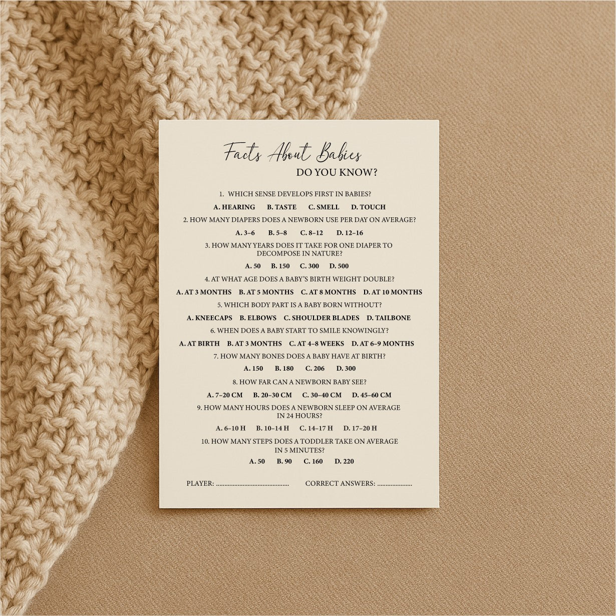 bold close-up of baby trivia cards on a dark table with dramatic lighting