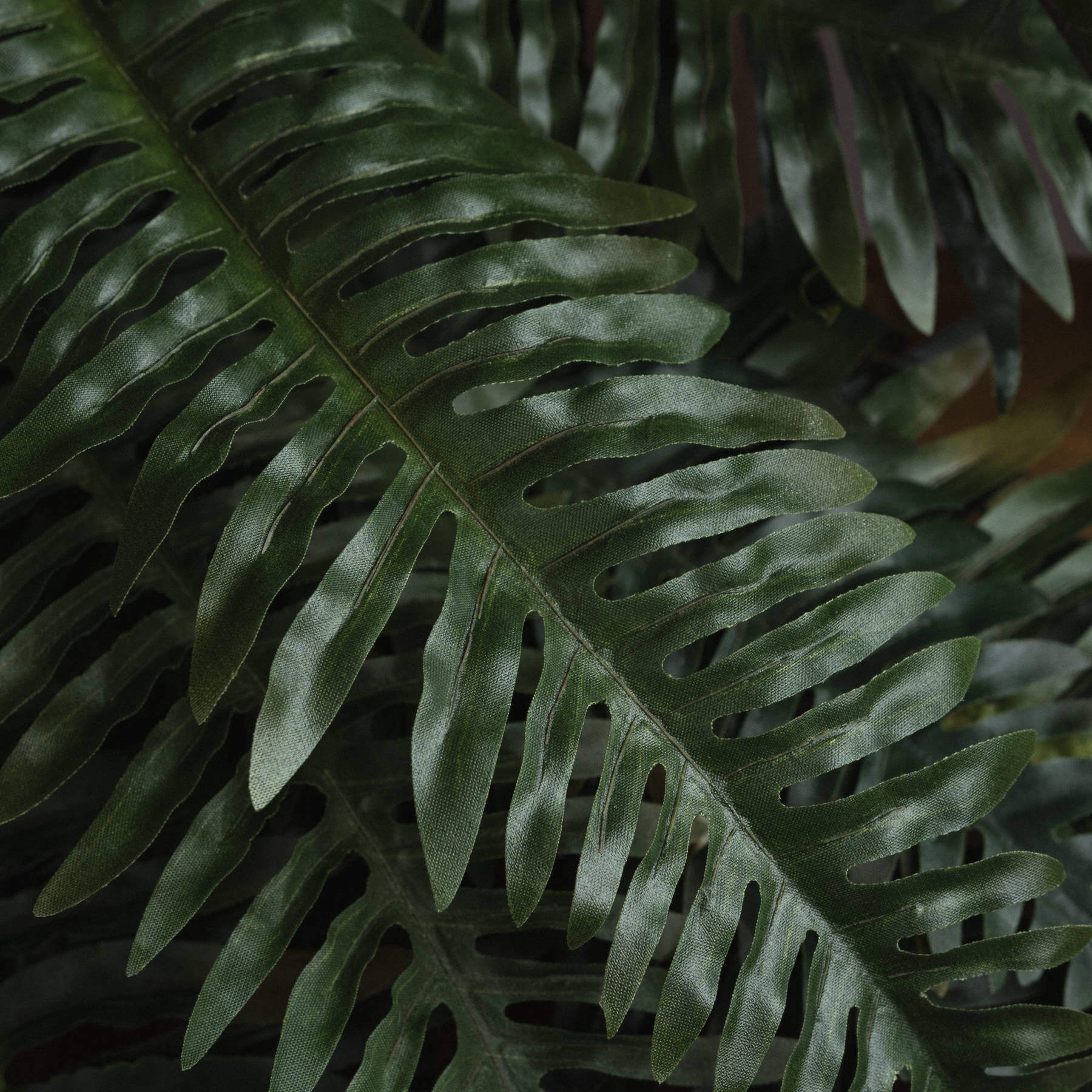Lifelike artificial fern bunch with cascading foliage, realistic vein patterns, and true forest green color for home decor. by sostter at brixbailey.com