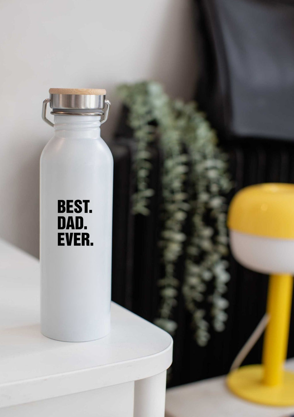 a bold close-up of the best dad ever thermos with its matte steel and bamboo lid