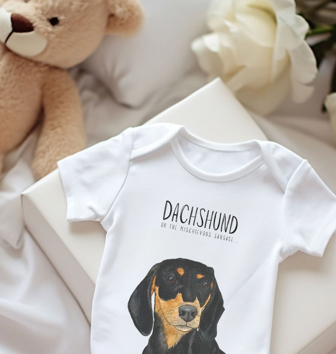 Mischievous Hot Dog Baby Bodysuit in Black and Tan