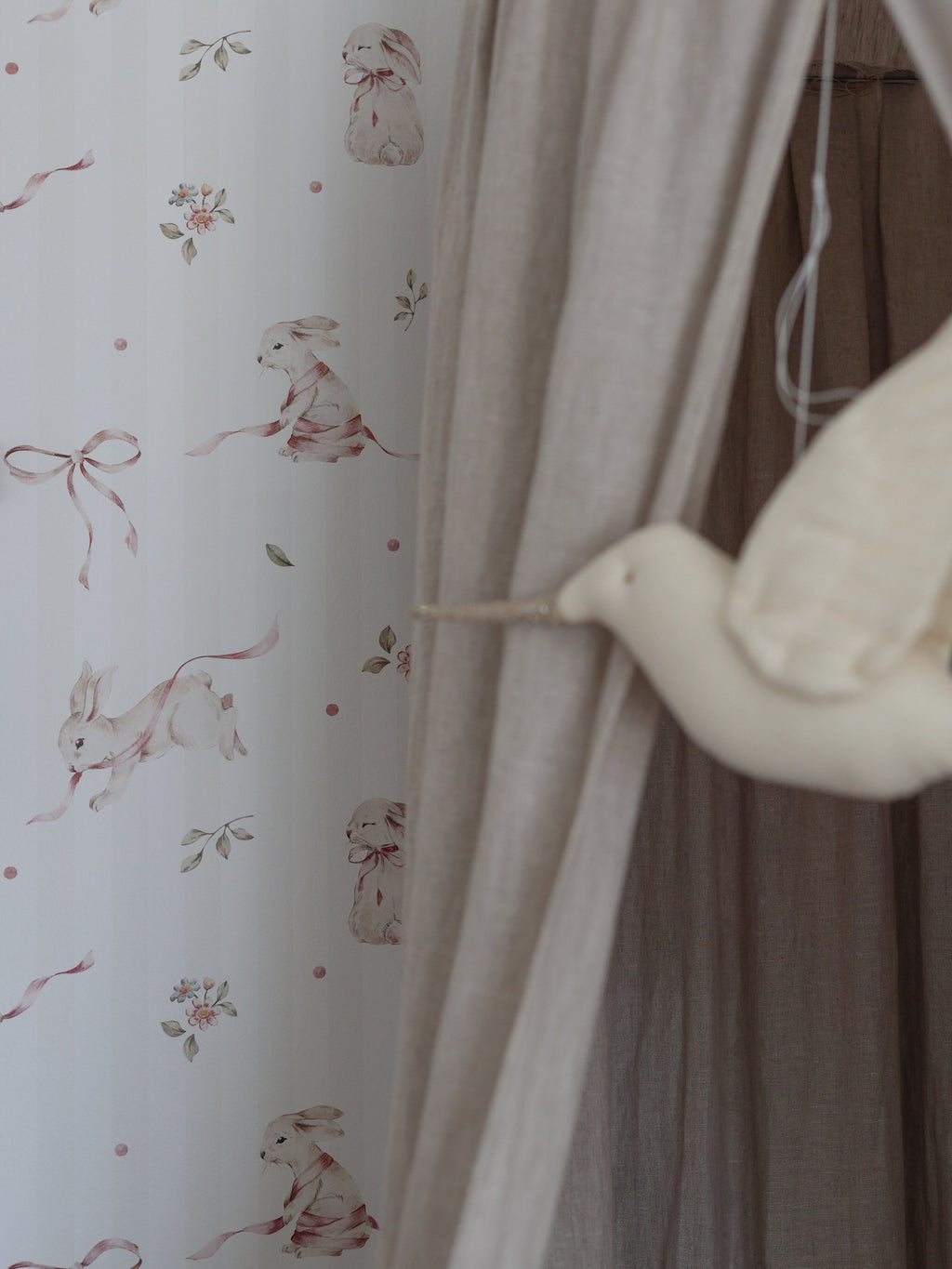 soft pink rabbit stripes wallpaper close-up with gentle morning light