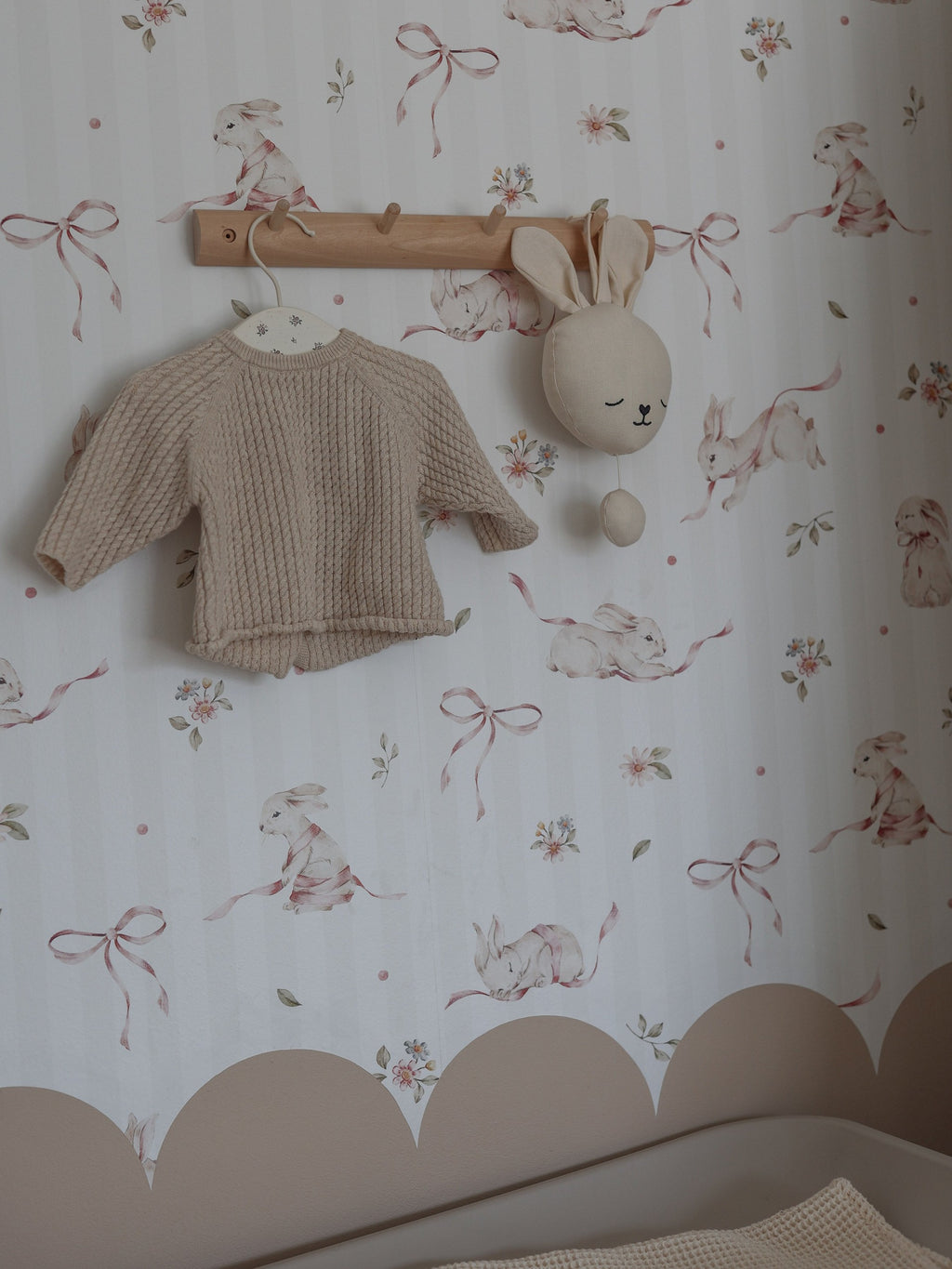 bold close-up of charming pink rabbits on stripes wallpaper for a kids room