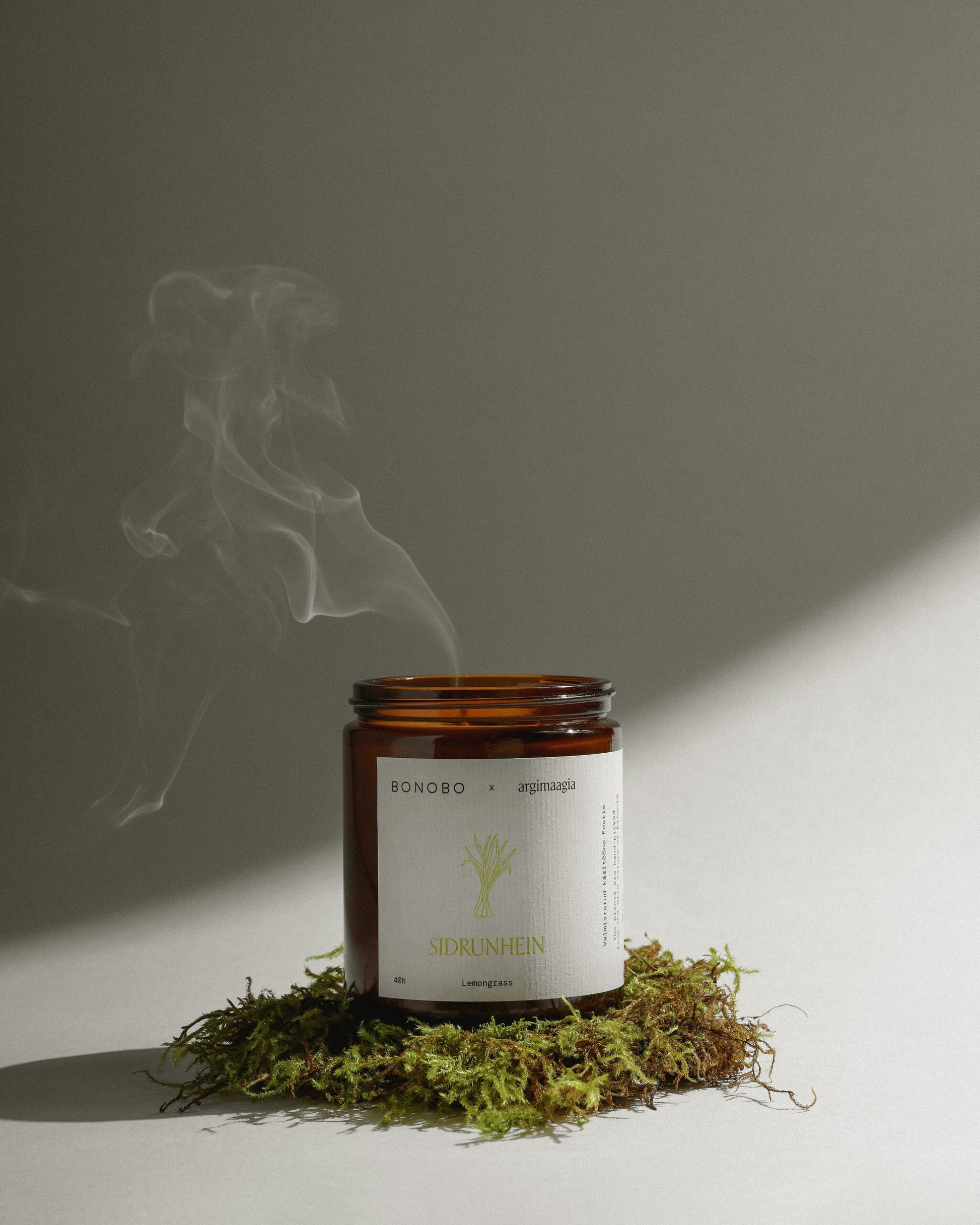 bold close-up of a handmade soy wax candle with a vibrant lemongrass glow