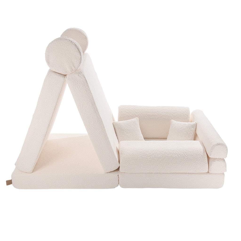 bold white boucle kids sofa in a bright modern living room setting