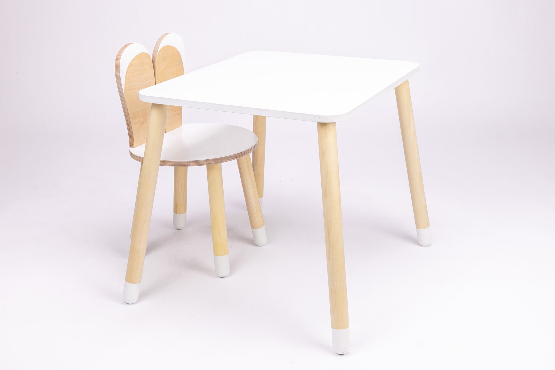 a soft-lit bunny table for kids in a cozy nursery corner