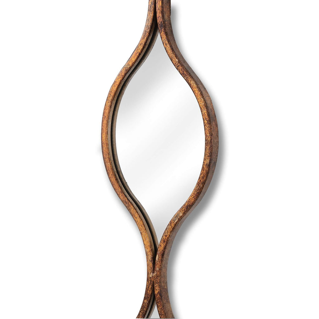 Aged gold wall mirror with warm patina, slim profile, and light-enhancing glass for elegant home decor by Sostter at brixbailey.com