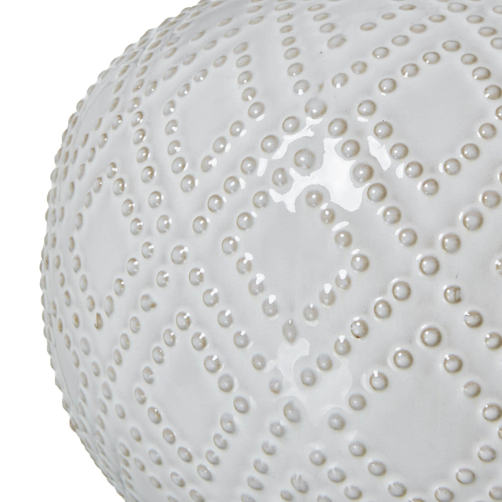 Handcrafted white ceramic lamp with beaded detail and linen shade, perfect for coastal or boho home decor. by Sostter at brixbailey.com