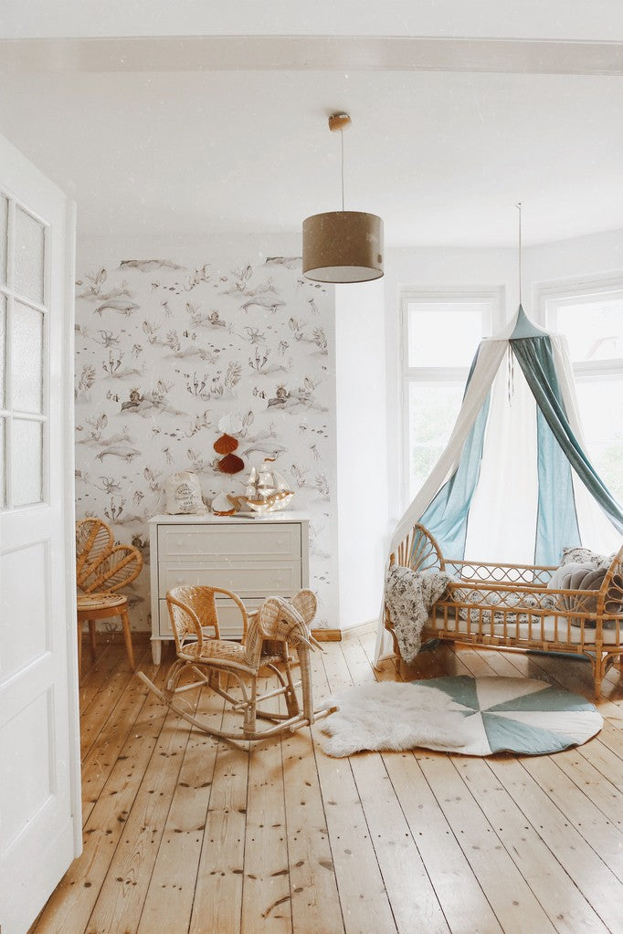 soft blue circus canopy draped over a cozy reading nook with gentle morning light