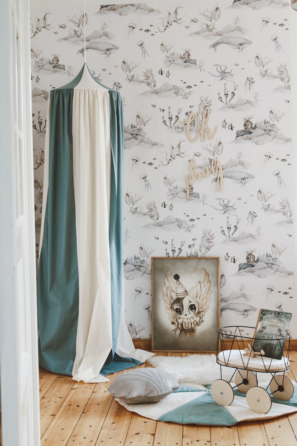 blue circus kids canopy hanging over a cozy reading nook with soft morning light