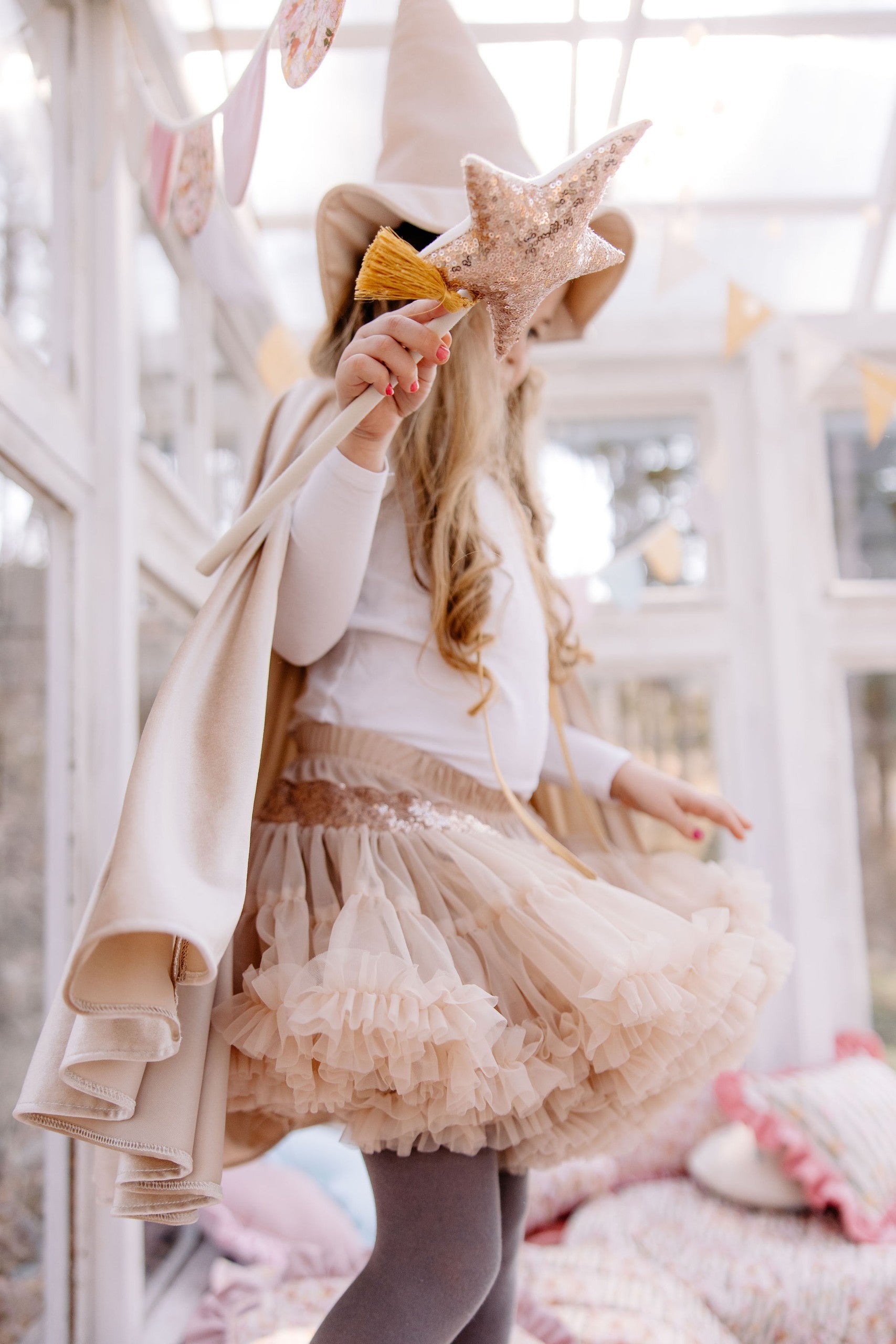 playful rose gold sequin cat mask for kids, sparkling in warm afternoon light during a fun dress-up game