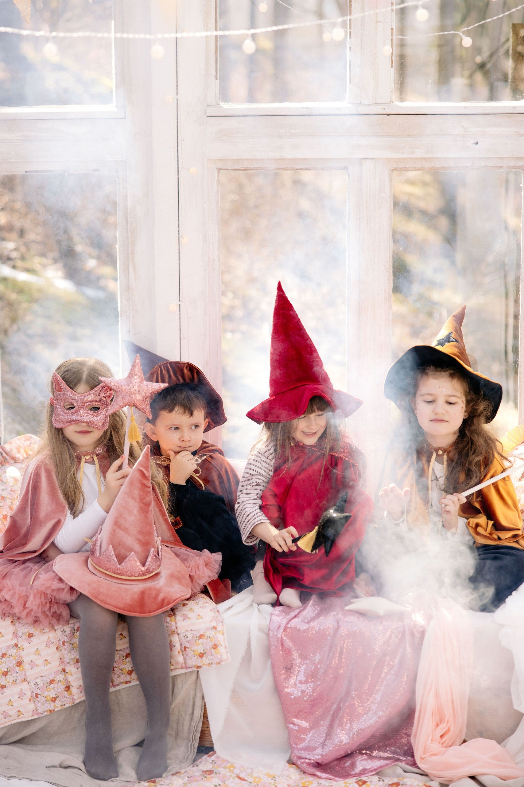 a whimsical pink sequin cat mask for kids on a soft velvet background