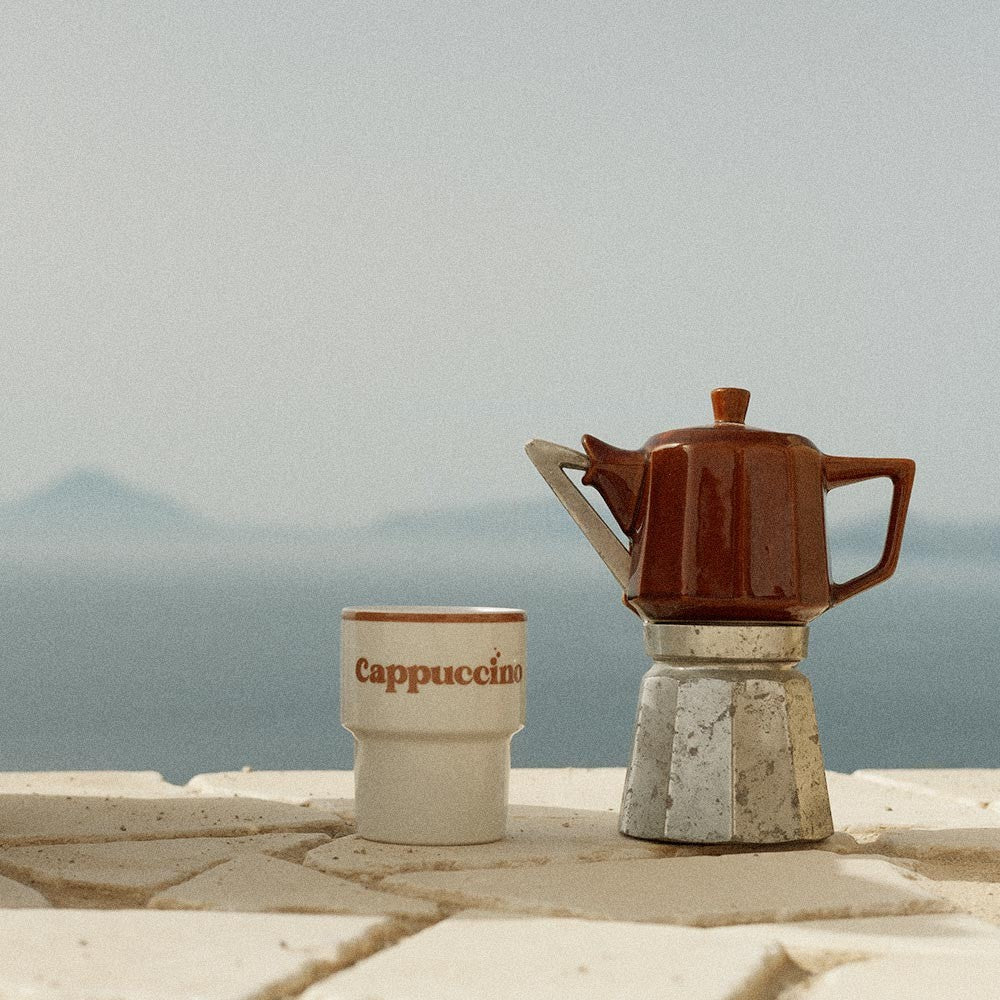 a playful ceramic cappuccino mug with a fun vintage pattern, perfect for a morning pick-me-up