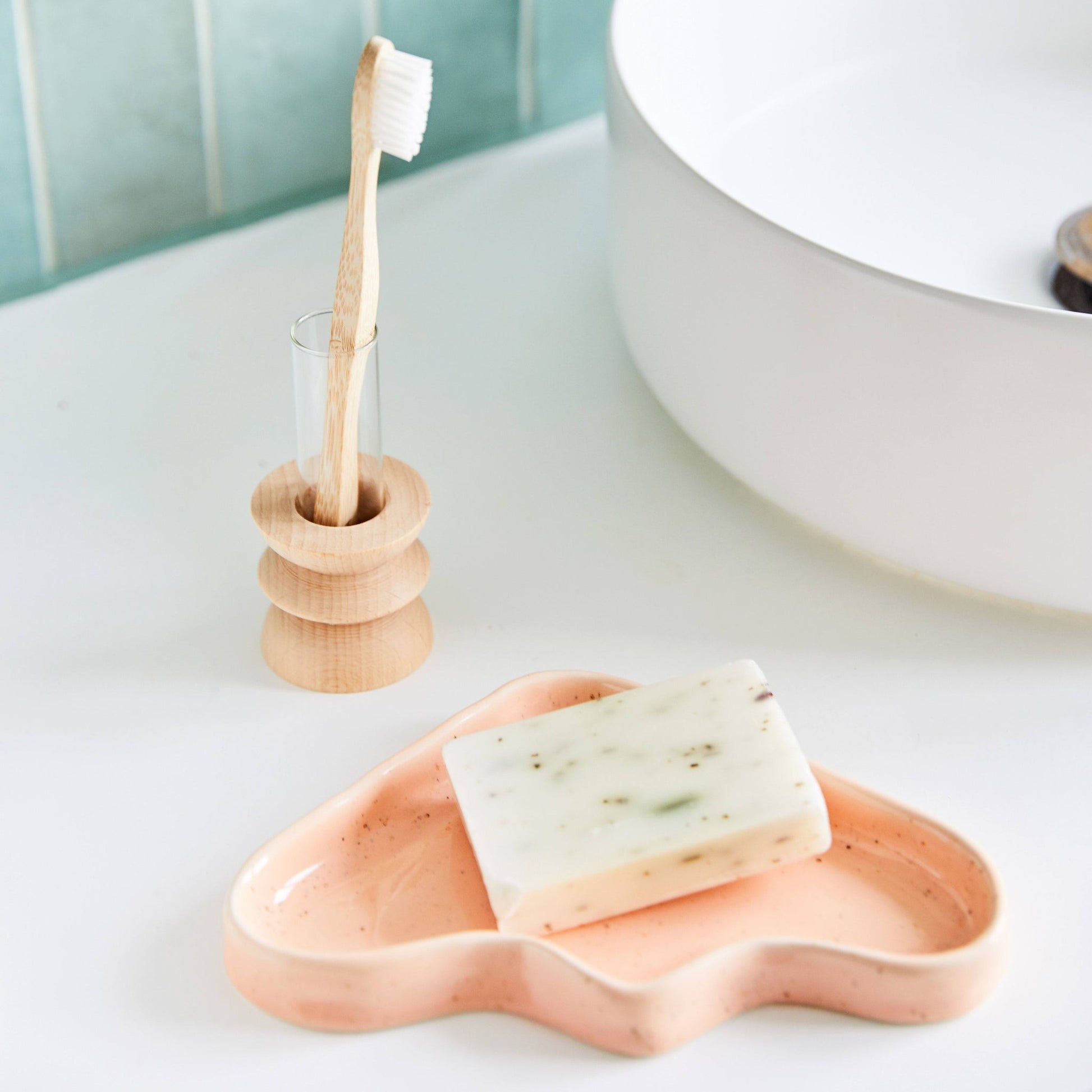 bold speckled peach ceramic triangle tray with playful wave design, perfect for jewelry or decor