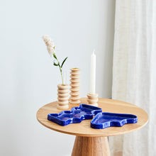 soft blue ceramic wave tray on a cozy linen tablecloth