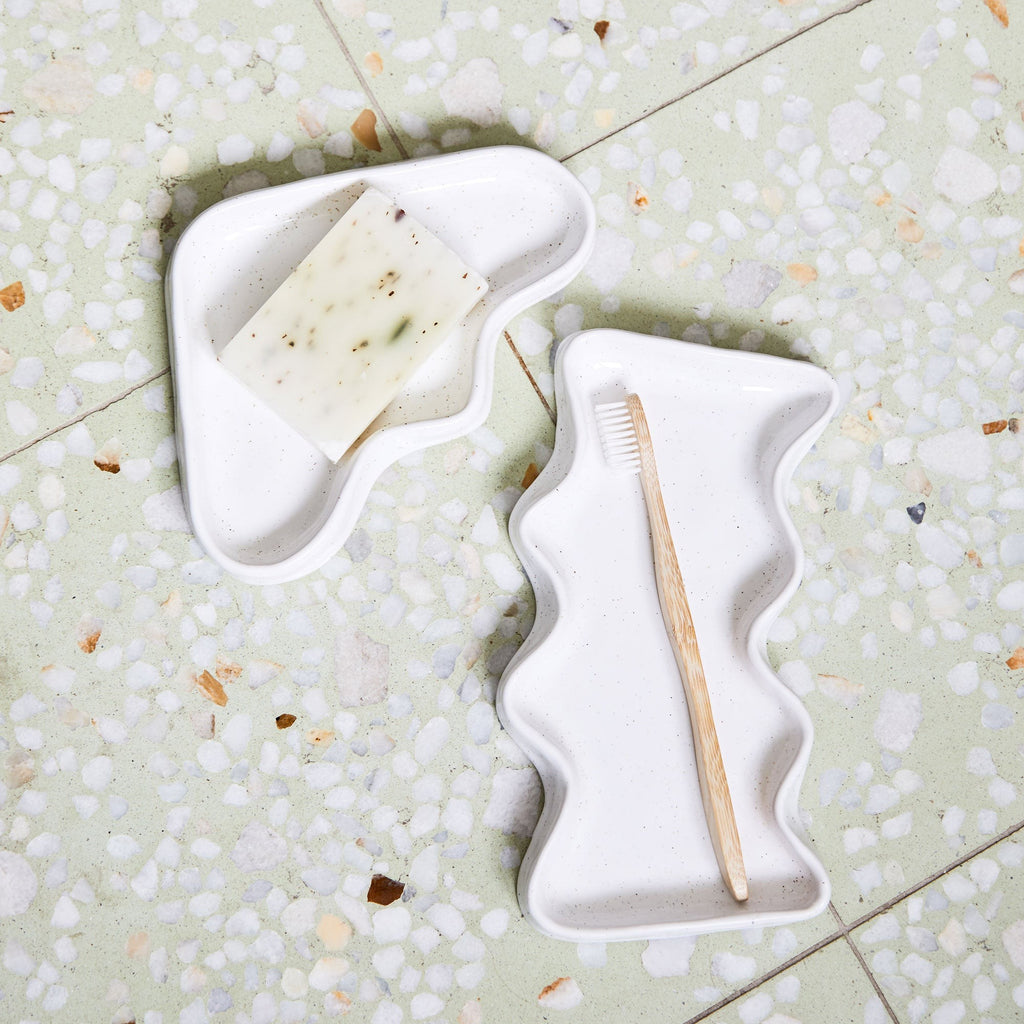soft speckled white ceramic wave tray on a cozy linen tablecloth, perfect for keys or trinkets