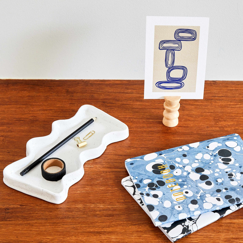 bold white ceramic wave tray with speckled glaze, modern and functional catch-all for keys or decor