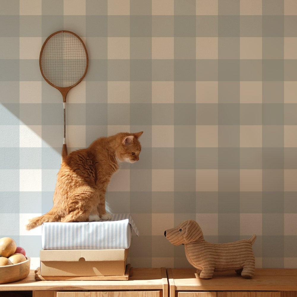 bold close-up of light blue check wallpaper with a crisp matte finish against a white paneled wall