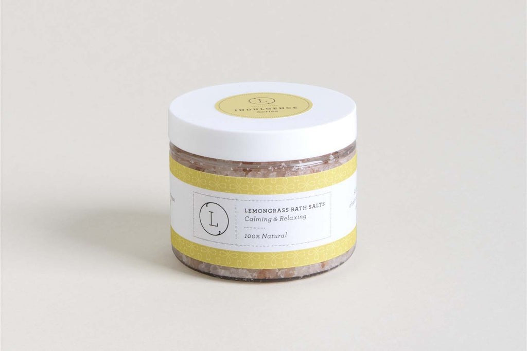 playful close-up of a grapefruit body scrub and citrus soap bar from a vibrant get-well gift basket