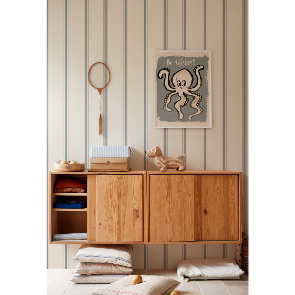 soft linen beige and blue striped wallpaper in a sunlit nursery with a cozy armchair