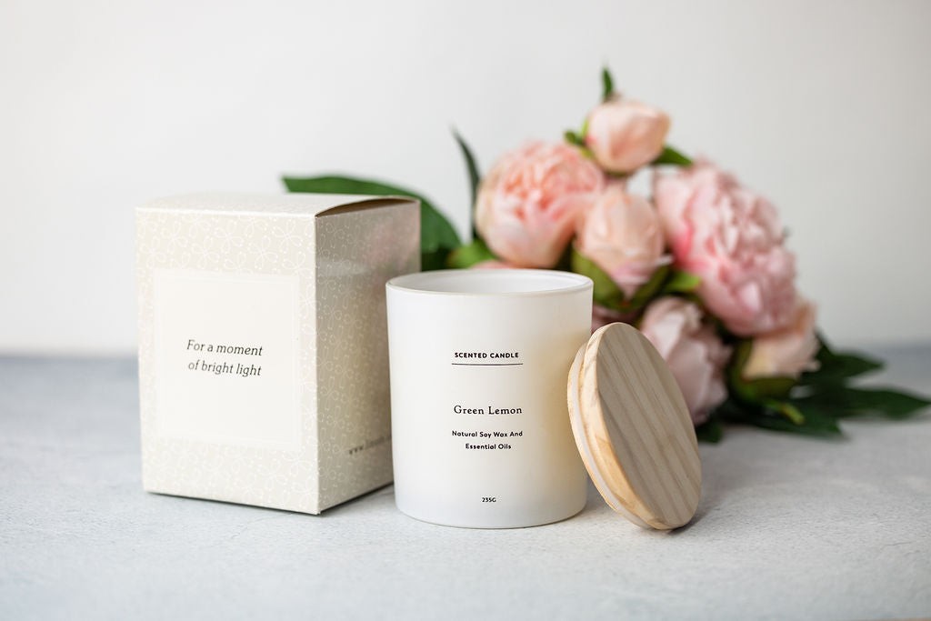 functional gift box open on a table showing the gray towel and grapefruit bath salt