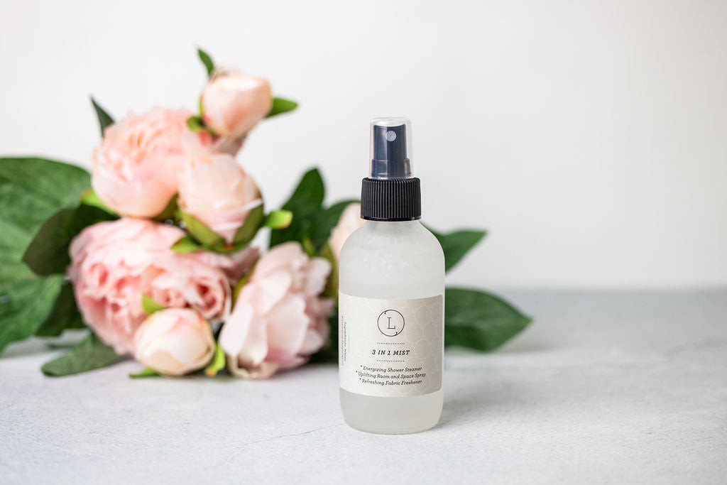a soft gray towel and grapefruit bath salt from a celebration gift box
