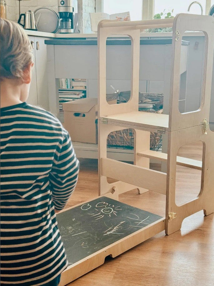 elegant birch plywood kids tower with blackboard in a refined, well-lit home setting