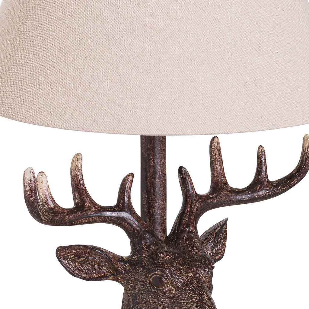 Handcrafted stag head table lamp with bronze resin base and natural linen shade, rustic home decor by RoomLondon at brixbailey.com