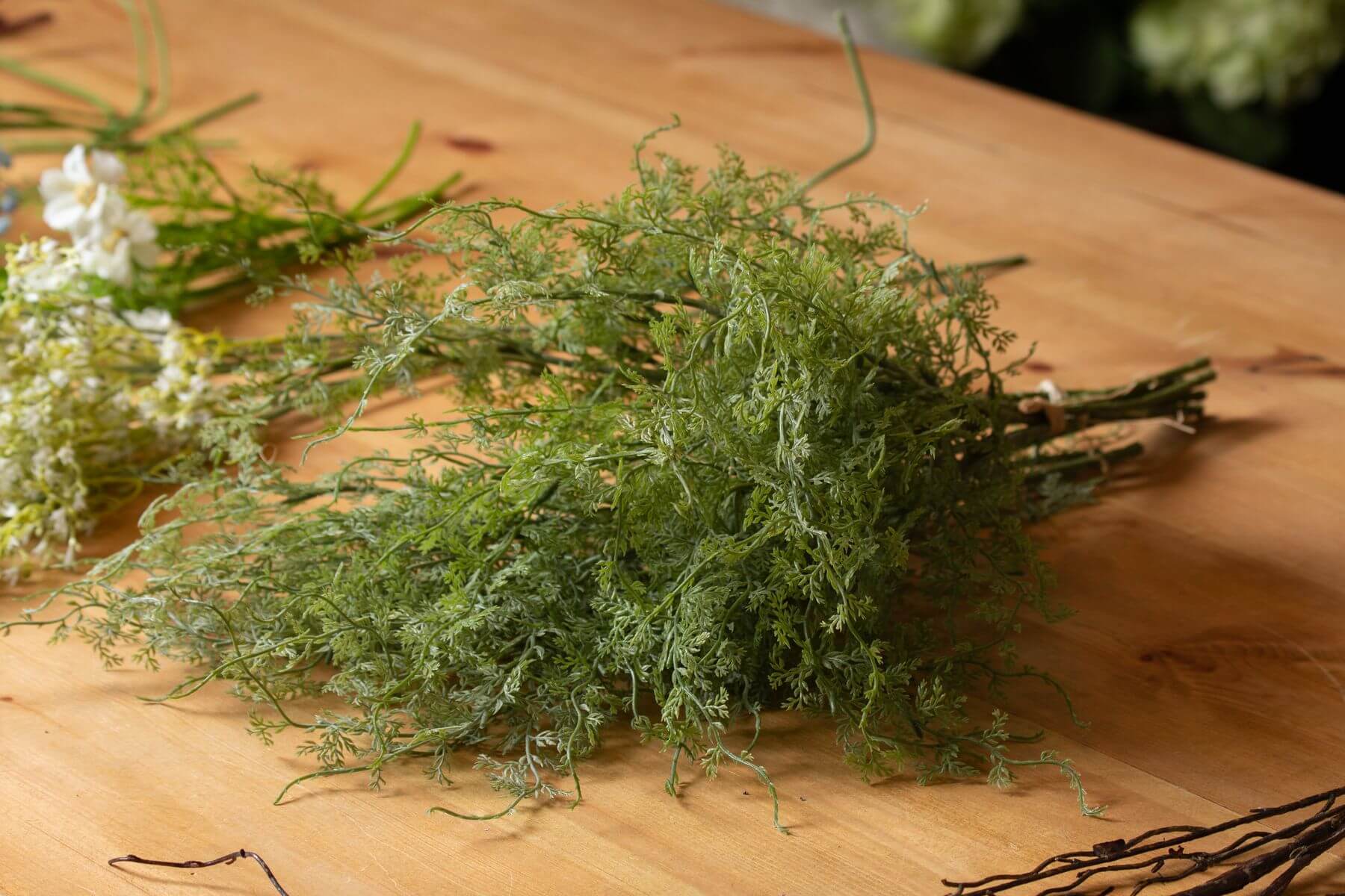 Lush artificial asparagus fern bunch in vibrant green, perfect for home decor or floral arrangements. by Sostter at brixbailey.com
