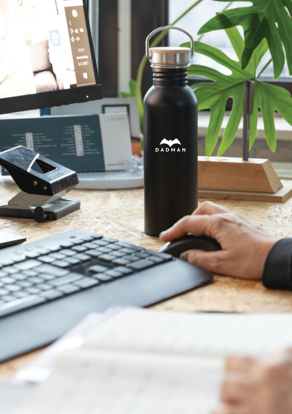 a soft-lit view of the dadman thermos with its warm bamboo lid and cozy handle