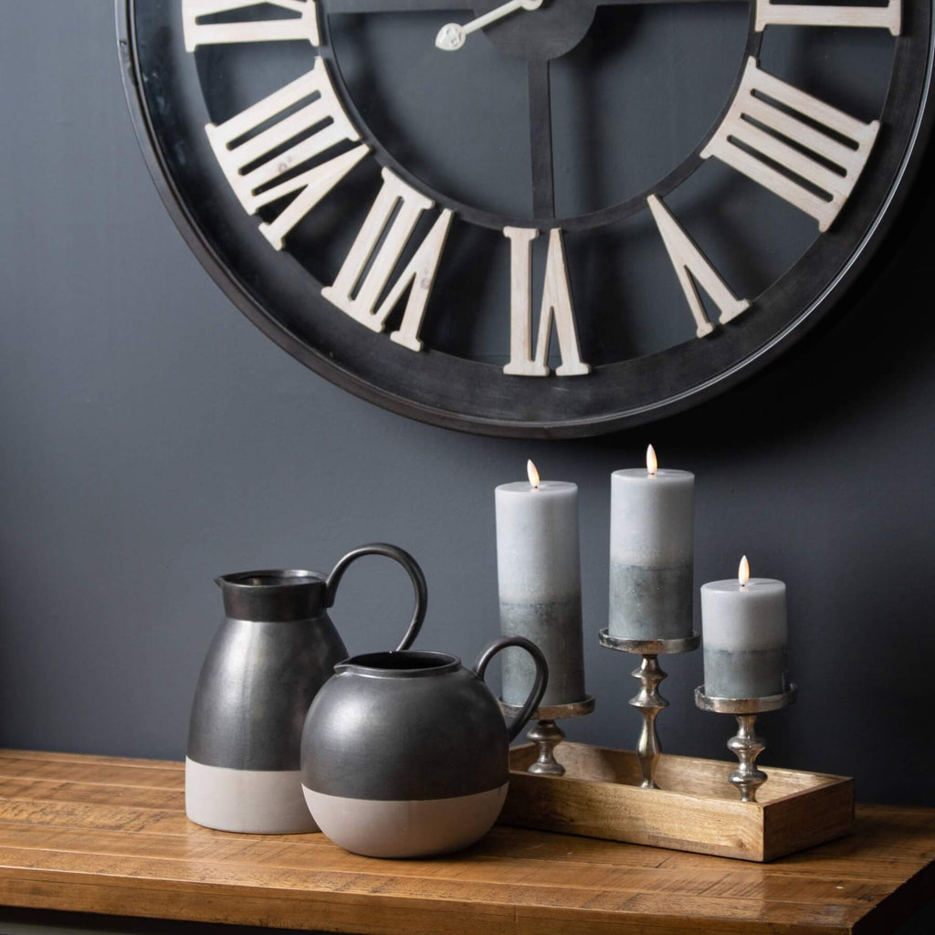 Stone finish LED candle with realistic amber flickering flame, elegant two-tone texture, and 6-hour auto timer. by RoomLondon at brixbailey.com