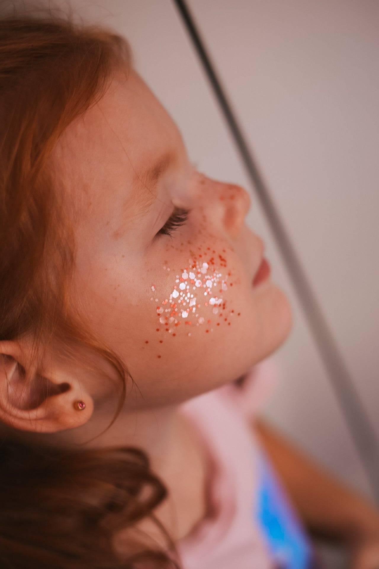 bold close-up of sparkling pink biodegradable star dust glitter in a glass jar