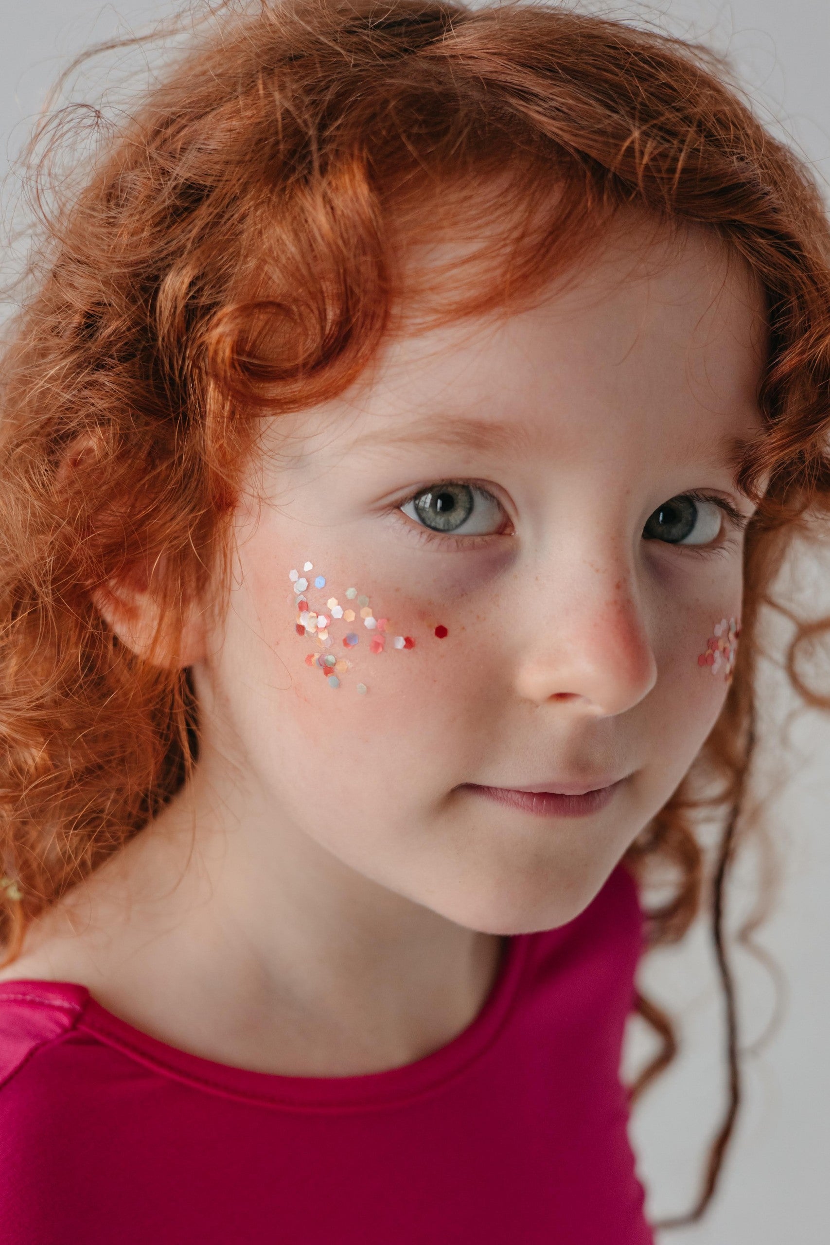 a playful splash of rainbow star dust eco glitter catching the light