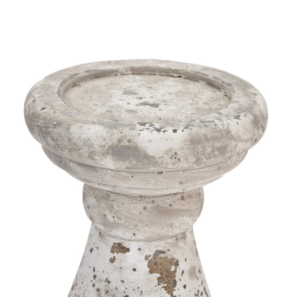 Handcrafted ceramic candle holder with natural stone texture in minimalist design, creating ambient lighting for home decor. by sostter at brixbailey.com