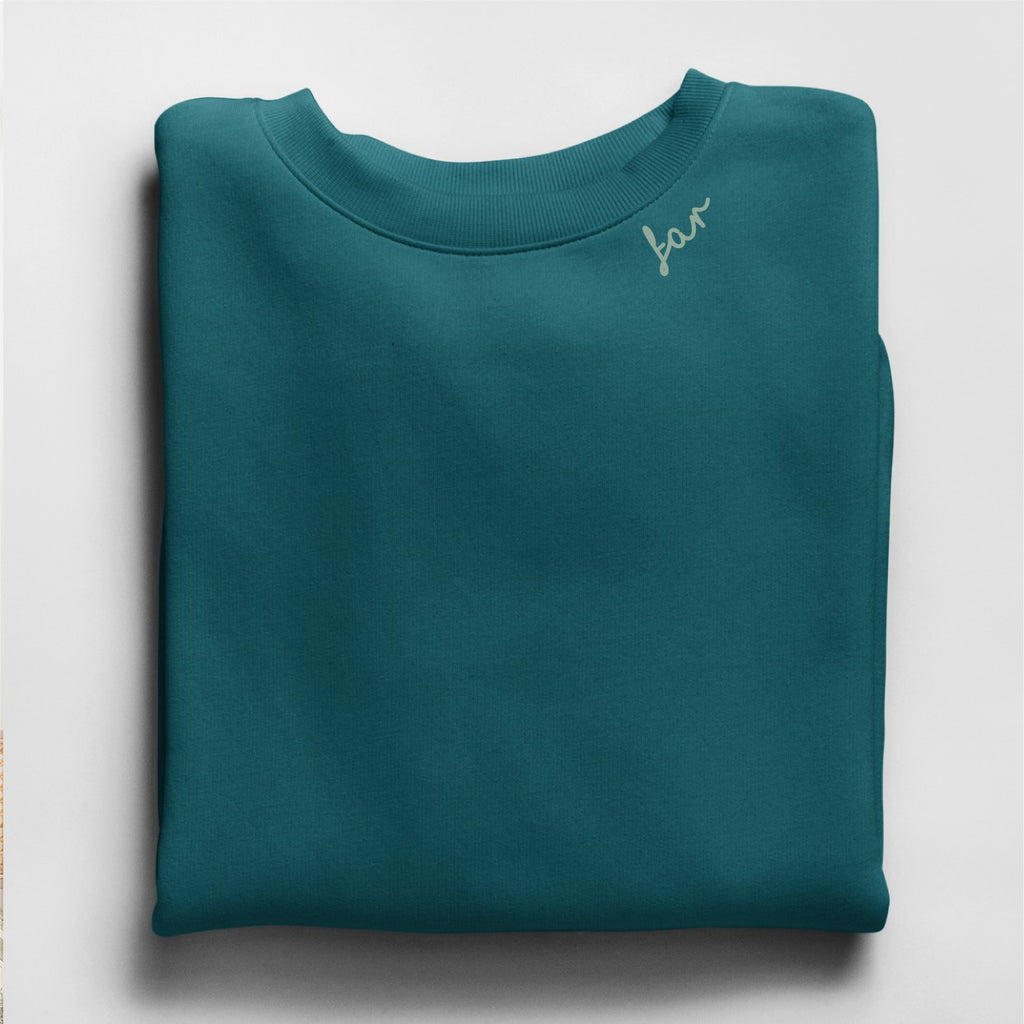 close-up of the embroidered far sweatshirt collar showing fabric texture and stitching detail