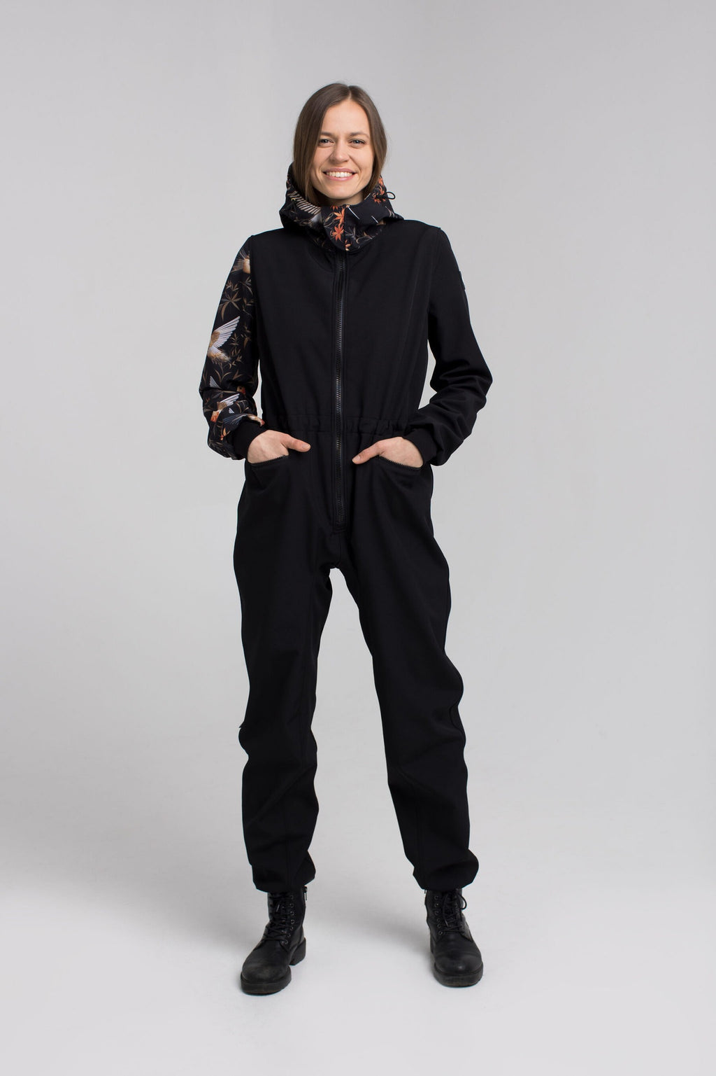 a softshell waterproof onesie for a baby, shown in gentle morning light, ready for a cozy puddle walk