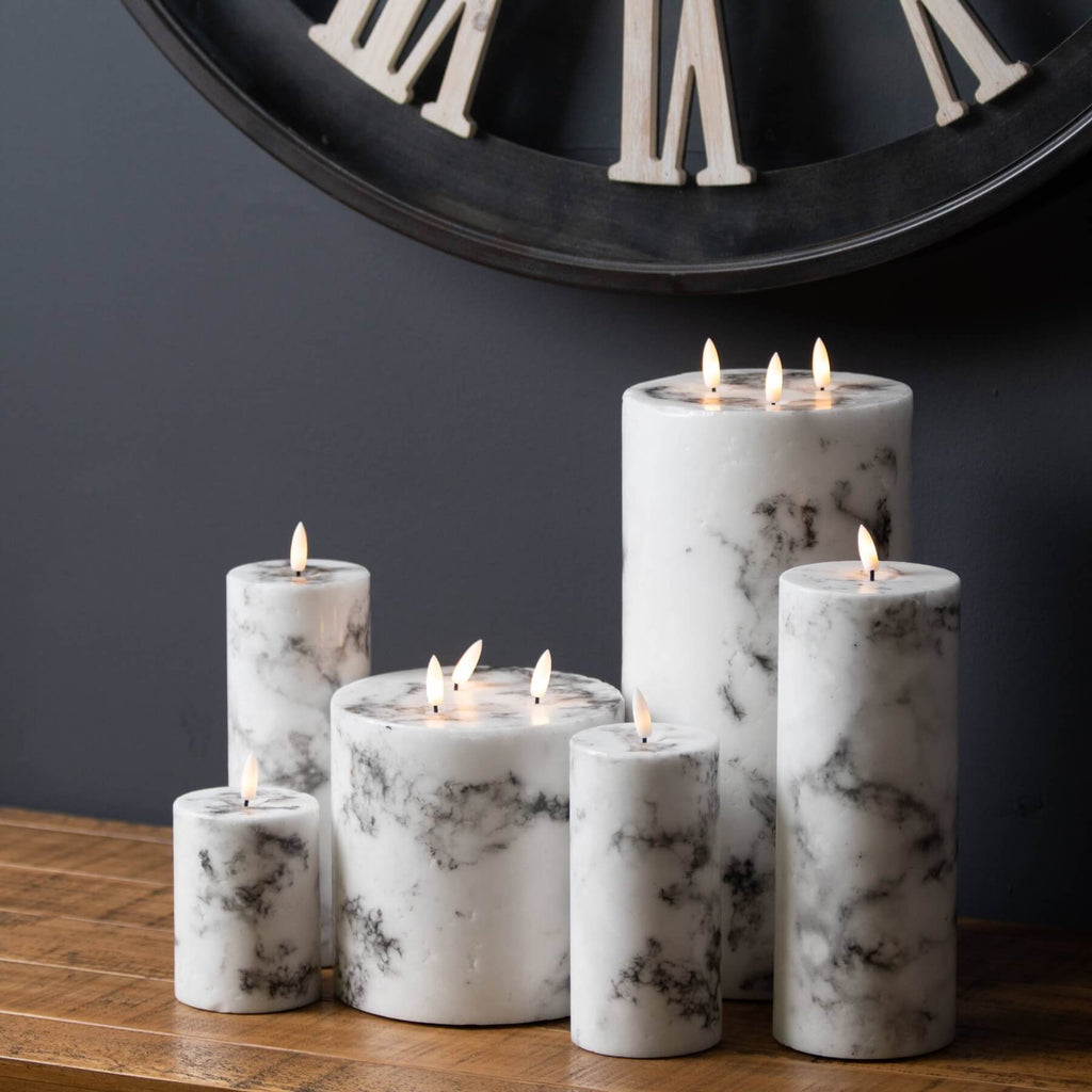 Marble-effect three-wick LED candle with realistic amber flicker, neutral white tones, and elegant design for home decor by Sostter at brixbailey.com