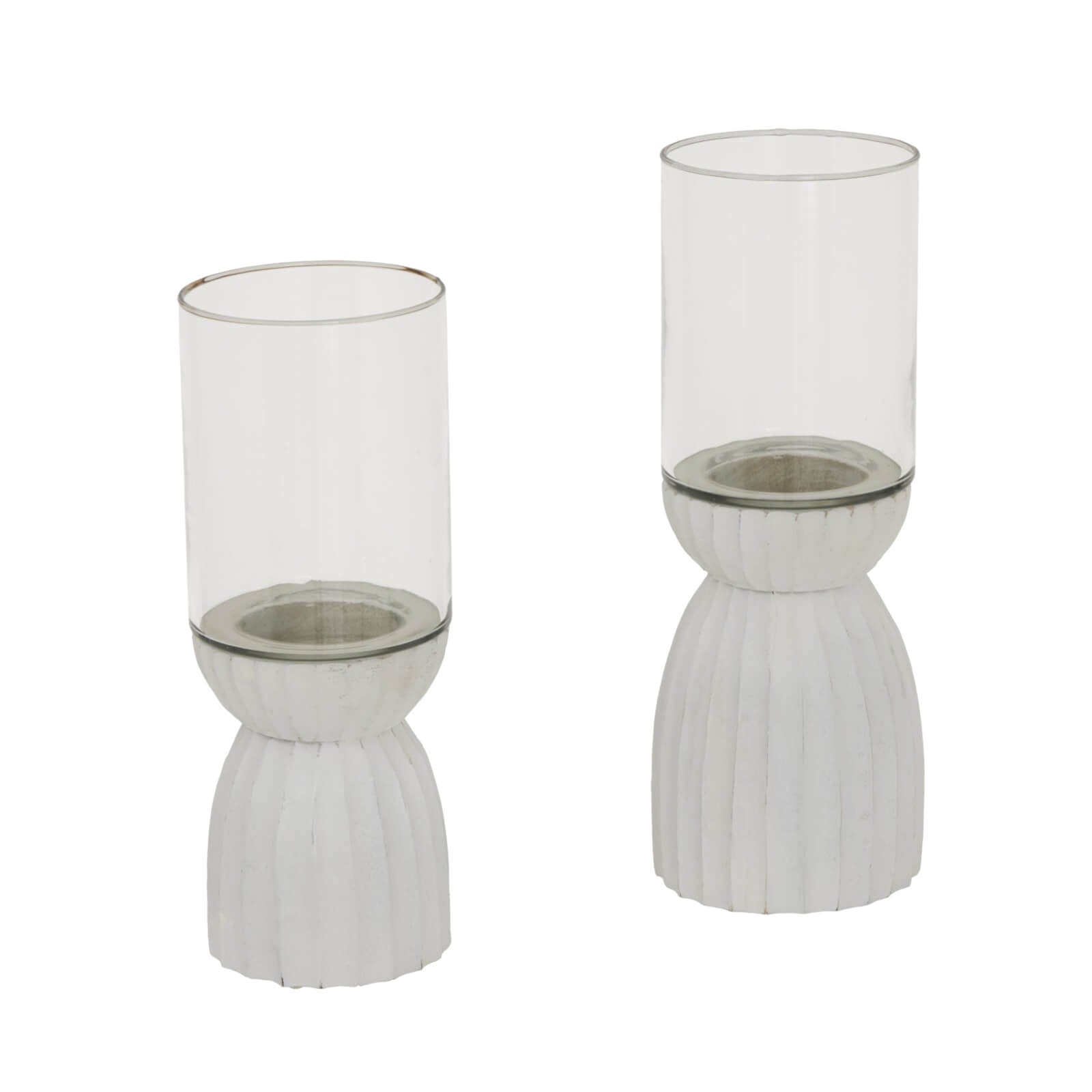Handcrafted white hurricane lantern with intricate carved patterns, casting ambient light for home decor. by RoomLondon at brixbailey.com