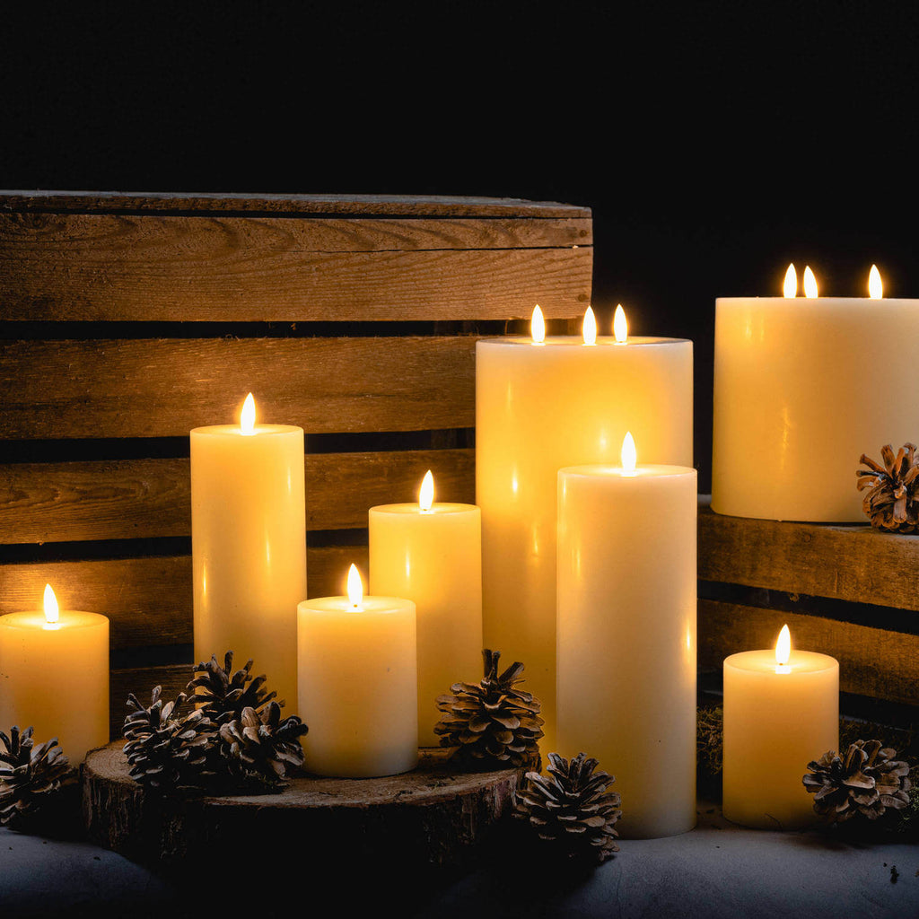Realistic ivory LED wax candle with flickering amber flame, safe flameless design, and textured finish by sostter at brixbailey.com