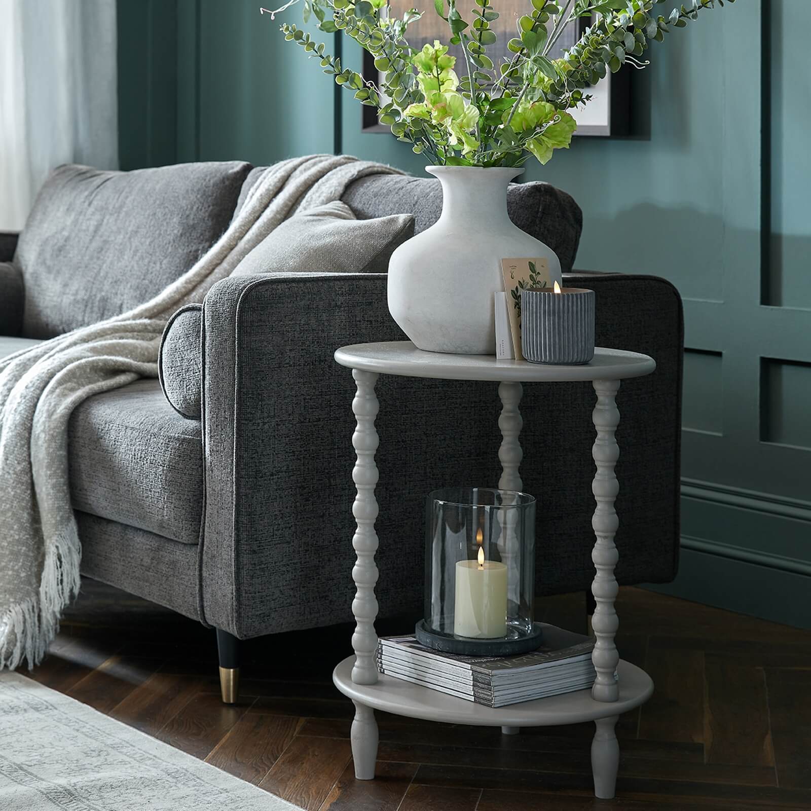 Circular grey wood accent table with modern design, perfect for living rooms or bedrooms, 60cm height. by Sostter at brixbailey.com