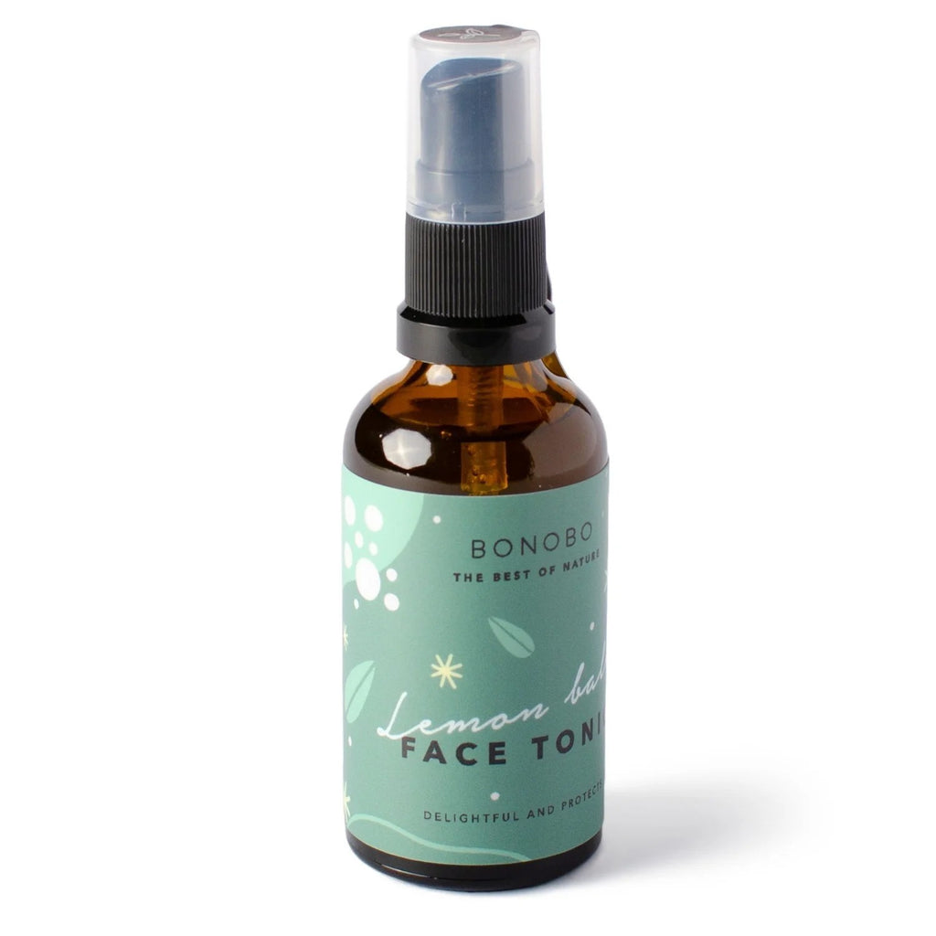 bold close-up of face tonic with lemon balm spray catching the light