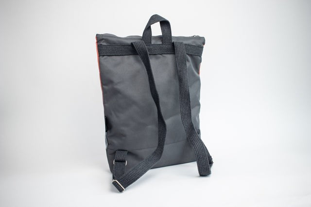 functional salmon faux leather backpack with multiple pockets and adjustable straps for daily organization