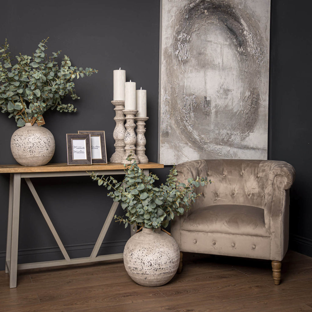 Handcrafted ceramic centerpiece with stone texture in neutral tone, emitting warm ambient glow for modern interiors. by sostter at brixbailey.com