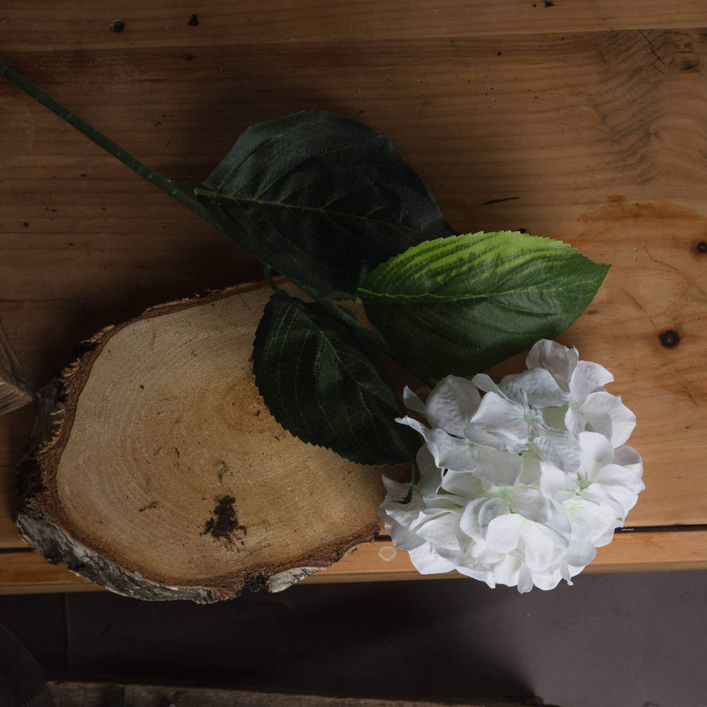 White artificial Schneeball hydrangea stem with hyper-realistic petals, perfect for vases or centerpieces, 71cm tall. by RoomLondon at brixbailey.com