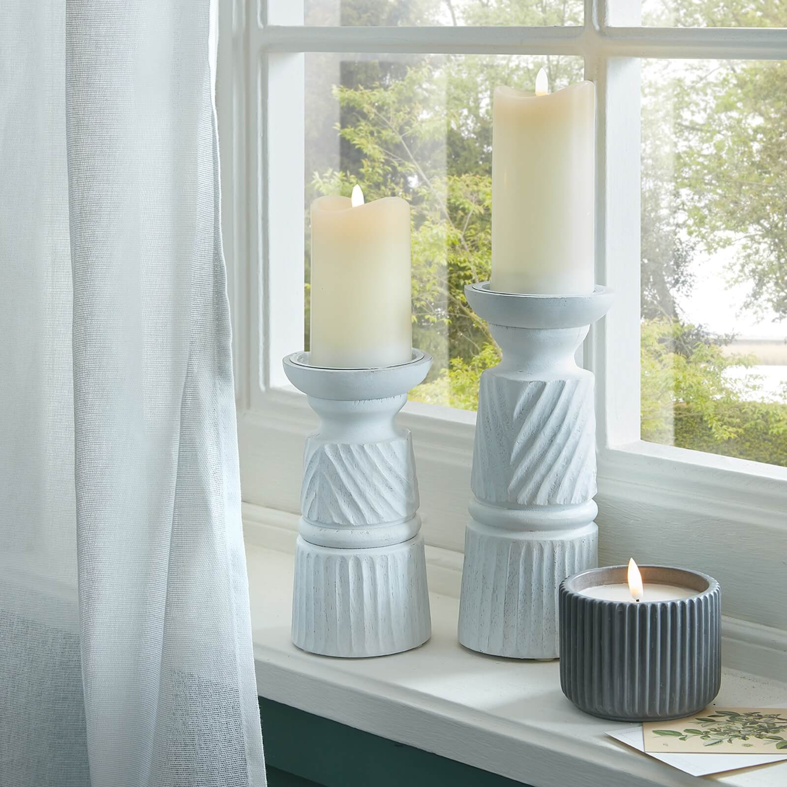 White carved wood candle holder with geometric patterns, elegant home decor centerpiece by RoomLondon at brixbailey.com