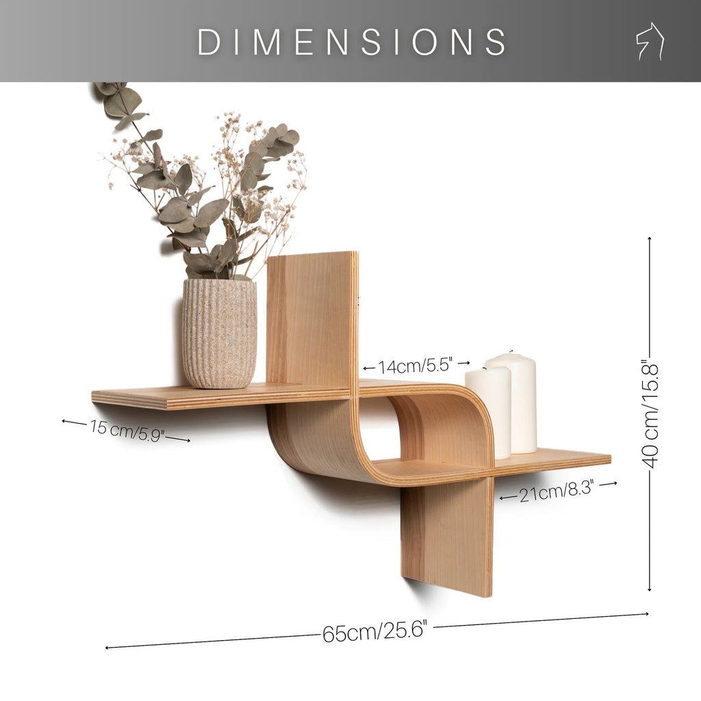 close-up of the practical floating shelf mount holding a stack of books