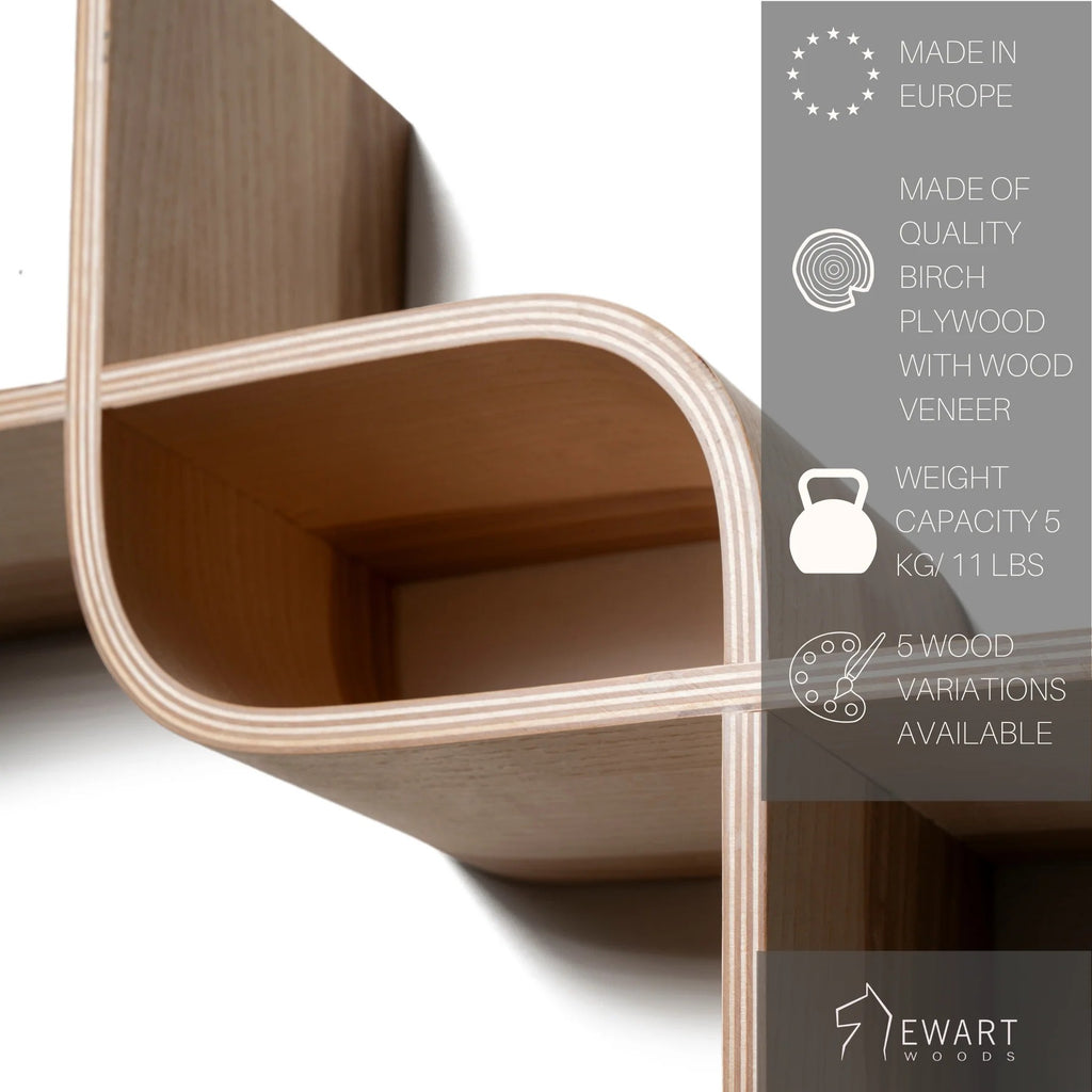 elegant curved floating shelf in a warm cherry finish displayed in a cozy study nook