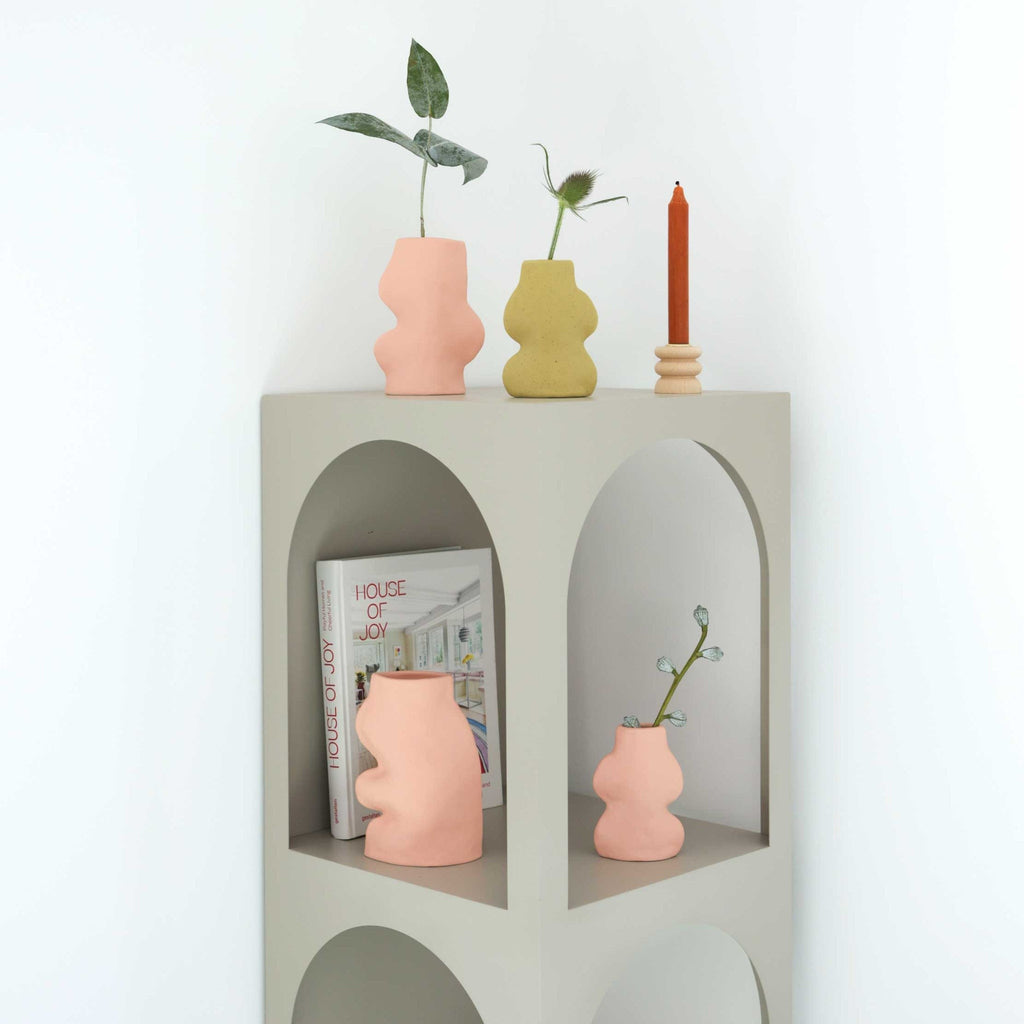 soft pink handmade ceramic vase on a cozy windowsill with morning light