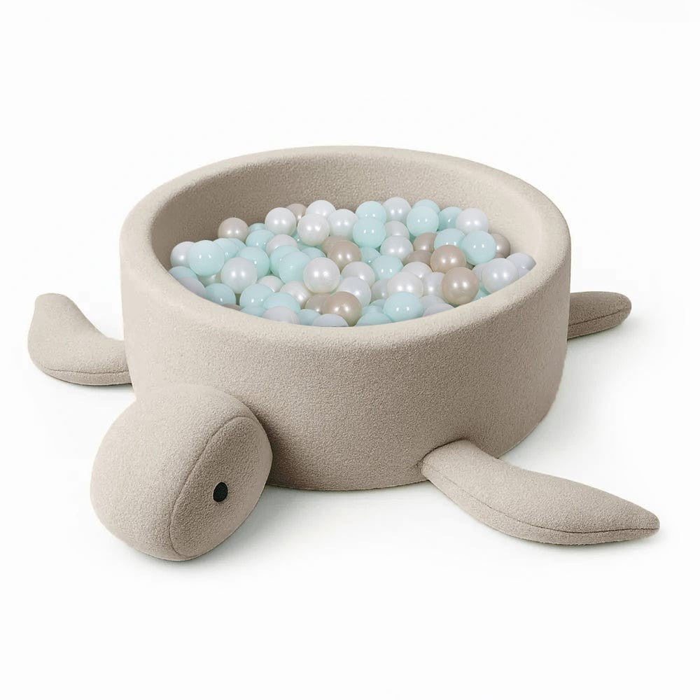 bold turtle boucle ball pit in warm morning light, a confident sensory play centerpiece