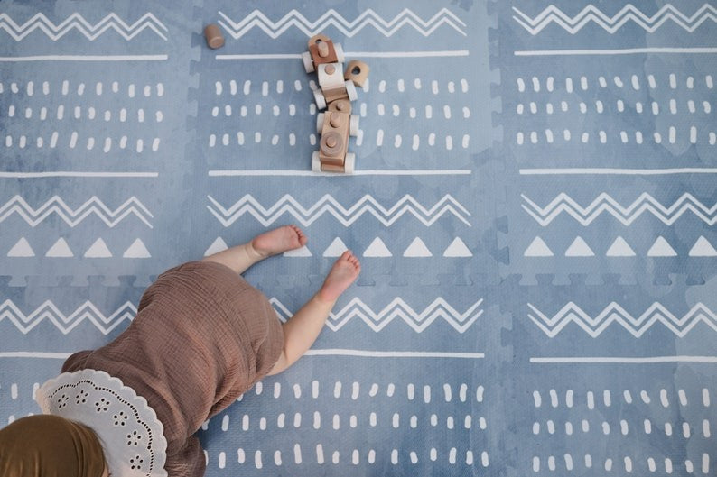 a close-up detail of the boho azure foam playmat showing its interlocking edge and cushioned texture