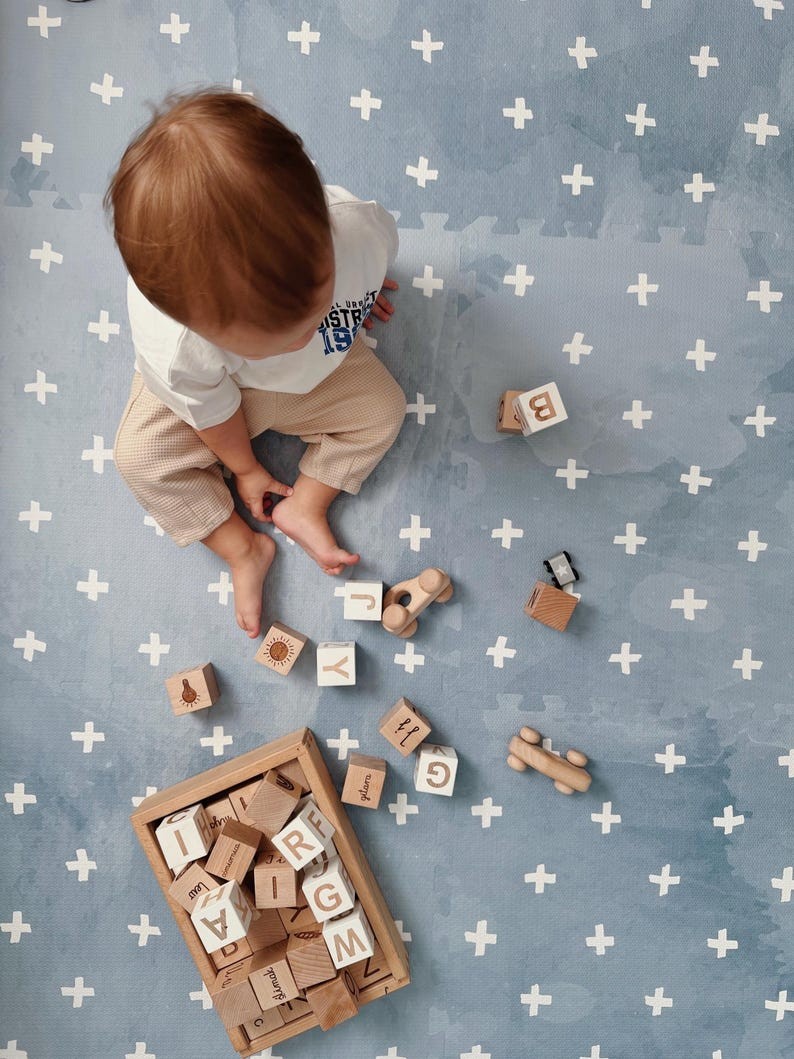 a close-up detail of the cross azure foam playmat showing its soft, non-toxic texture